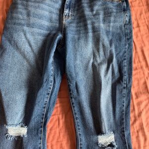 Dark and ripped “Dad” jeans